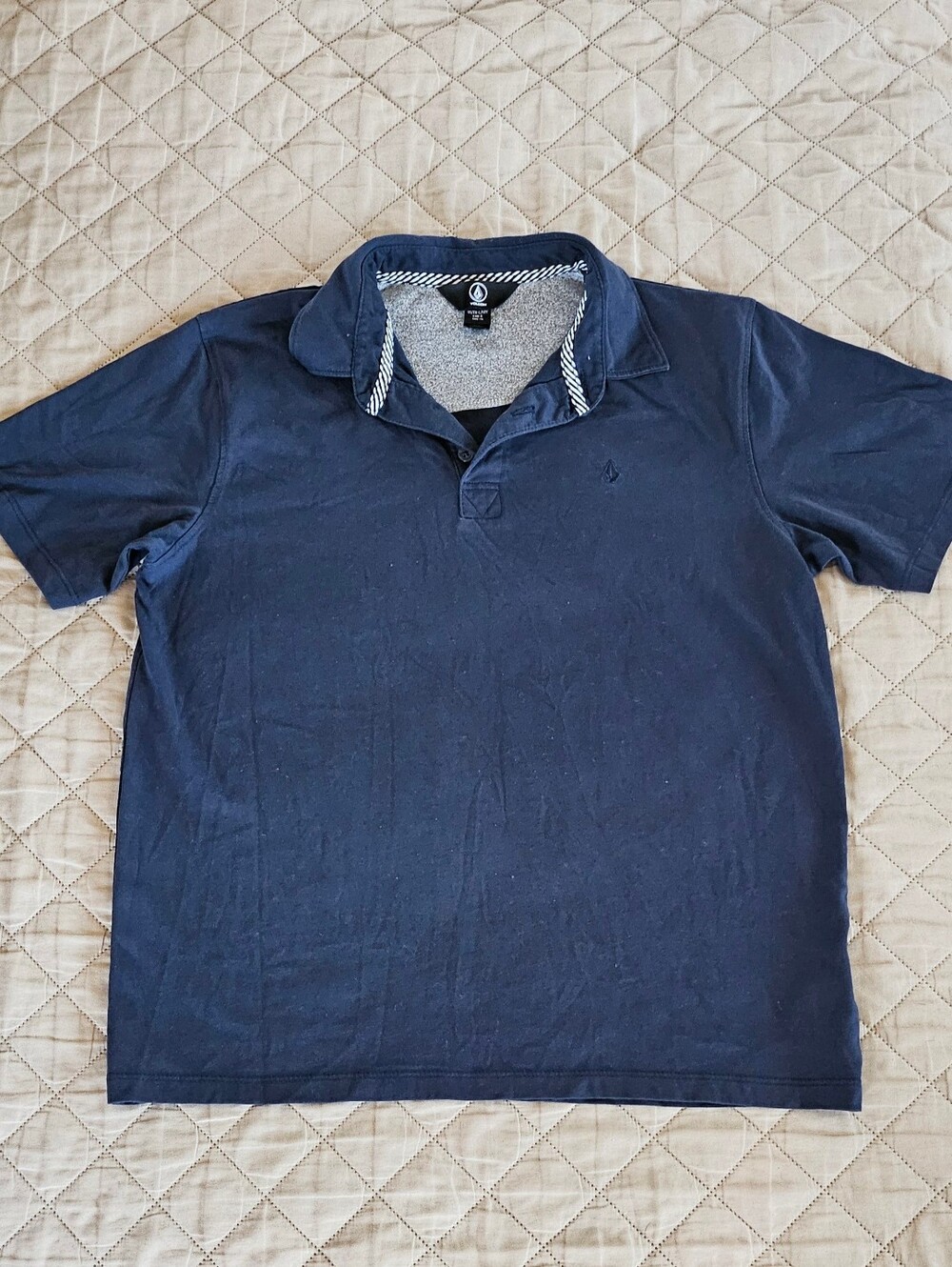 Boys size 12, navy blue shirt, brand is volcom.